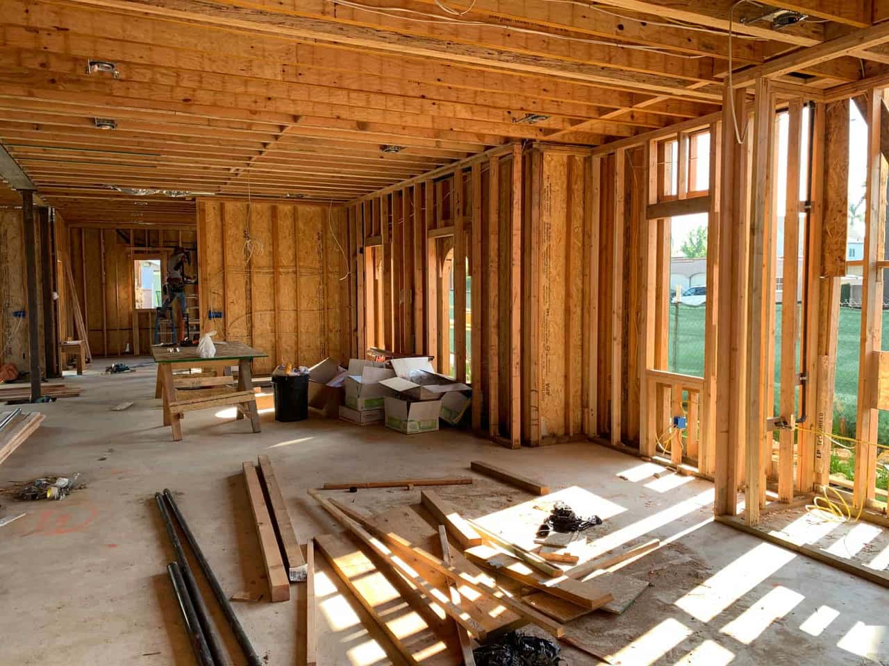 The underside of a house showing crawl space joists and piers
