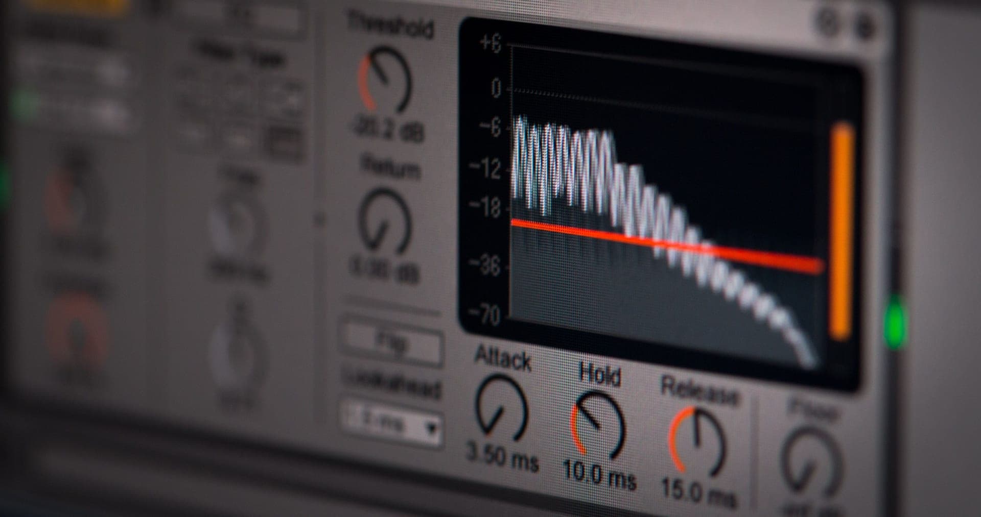 An audio meter in a darkened room